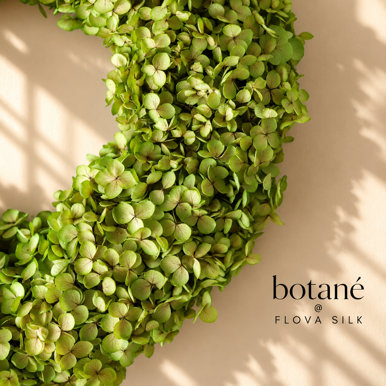 Close-up of Light Green Hydrangea Wreath by Botané at FLOVA SILK, featuring real preserved hydrangea flowers in fresh lime green tones.