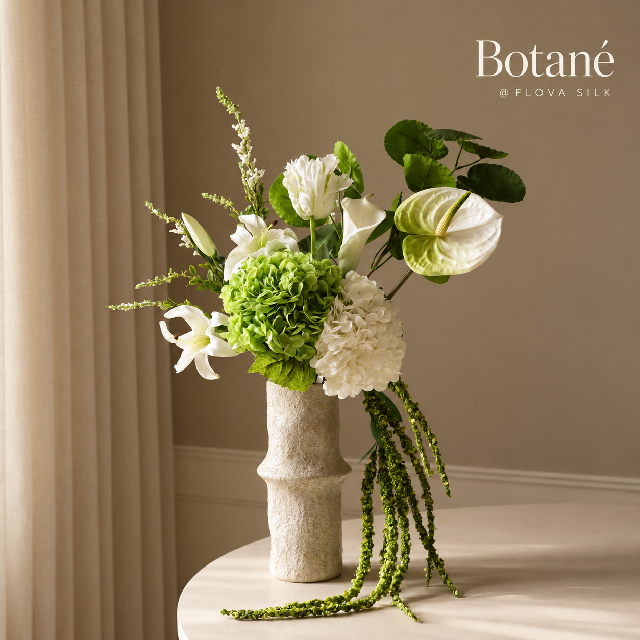 Greenie luxury artificial flower arrangement by Botané at FLOVA SILK with green and white hydrangeas, white anthurium and cascading green amaranthus.