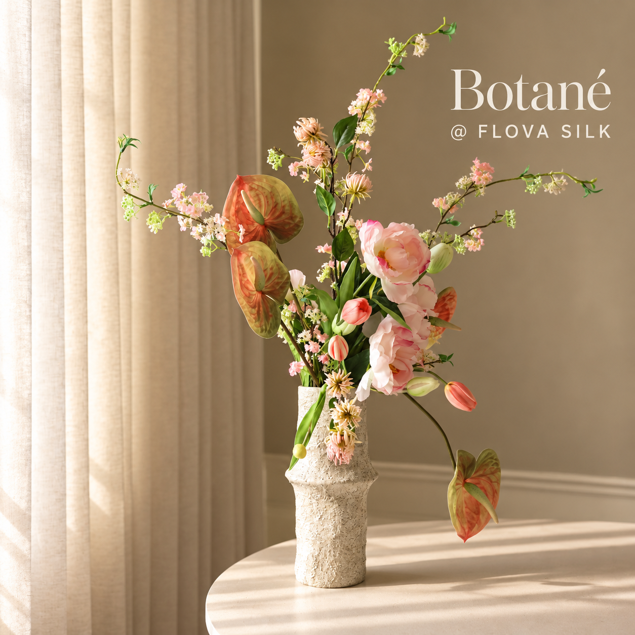 Blossom Reverie luxury artificial flower arrangement by Botané at FLOVA SILK with soft pink peonies, tulips, anthuriums and delicate flowering branches.