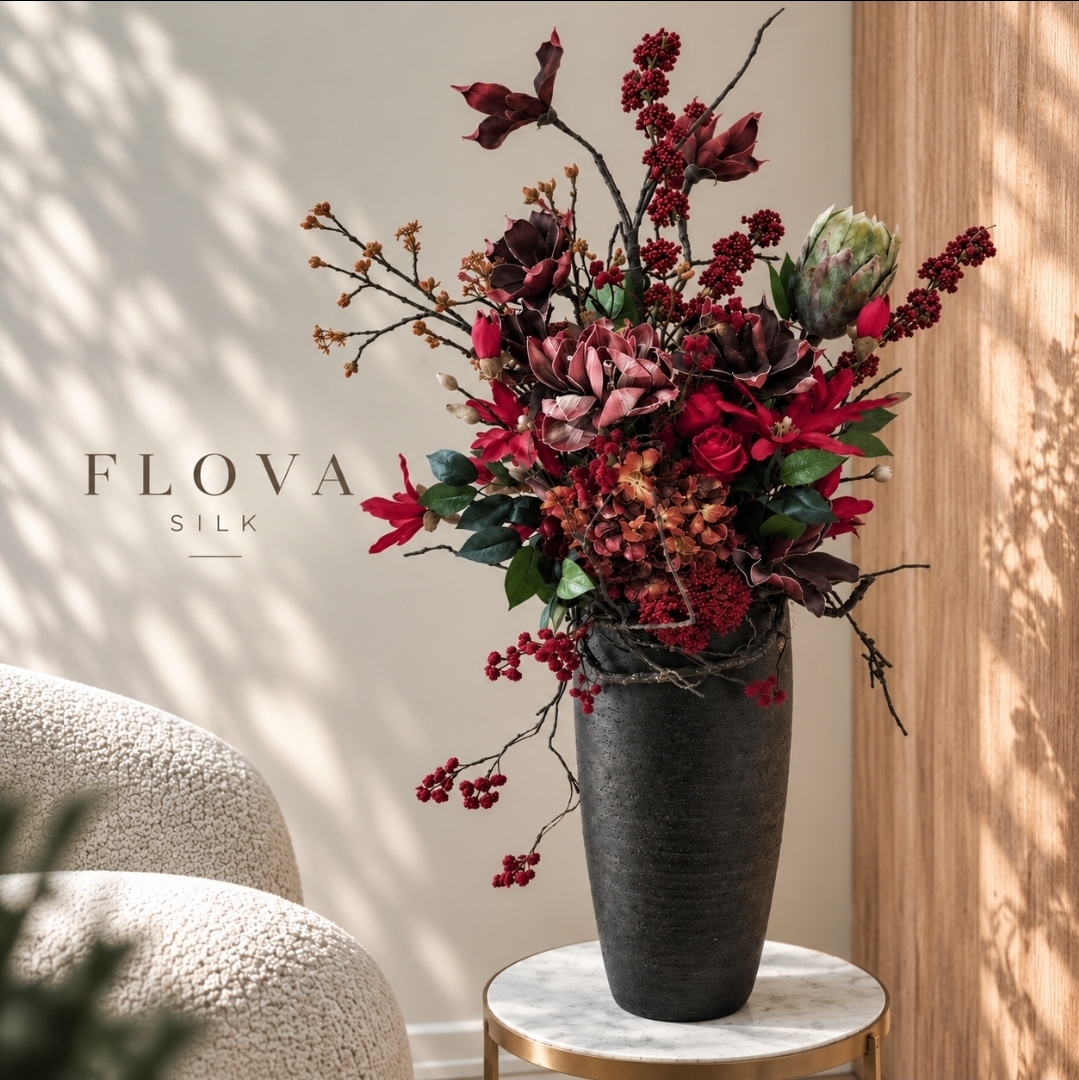 Luxury burgundy silk flower arrangement in a tall black ceramic vase