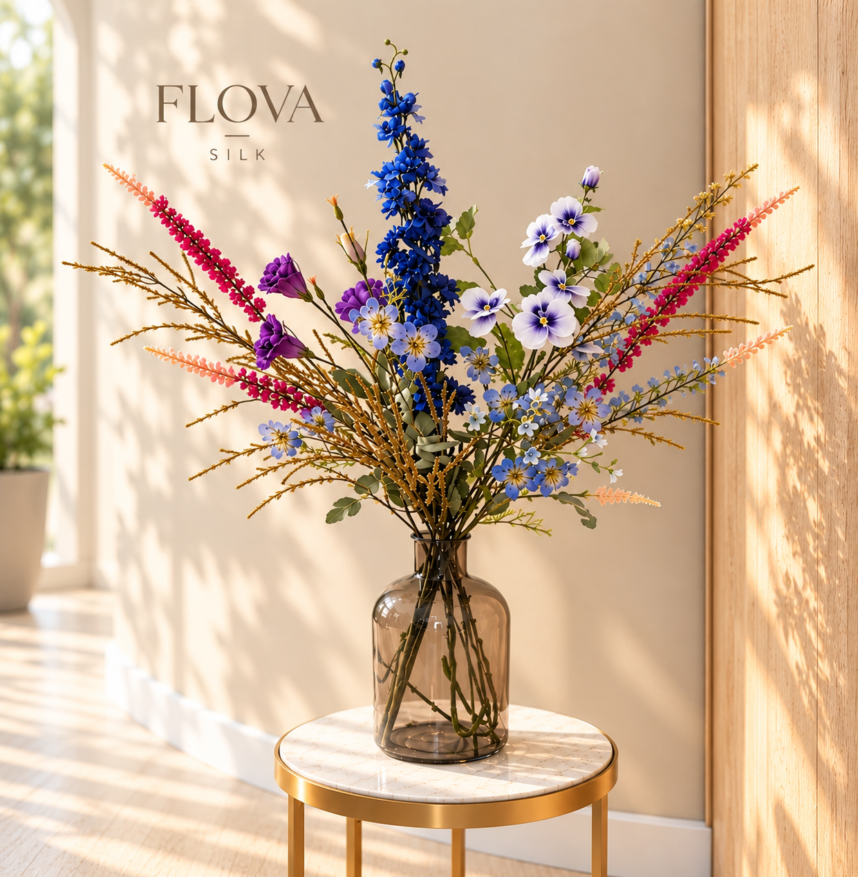 Luxury silk flower arrangement with blue, purple and pink artificial flowers in an elegant glass vase.

Luxe zijden bloemstuk met blauwe, paarse en roze kunstbloemen in een elegante glazen vaas.